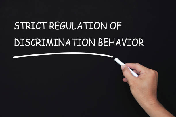 istock Strict regulation of discrimination behavior text written on blackboard. Safe workplace concept 2170986968