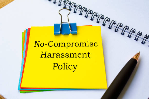 istock No compromise harassment policy text written on yellow sticky note. Protection at workplace concept 2170986976