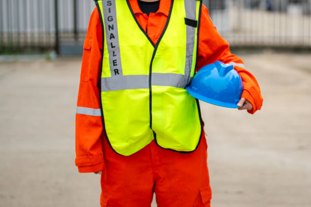 istock A crane signaler with fully safety PPE uniform. 2170987441
