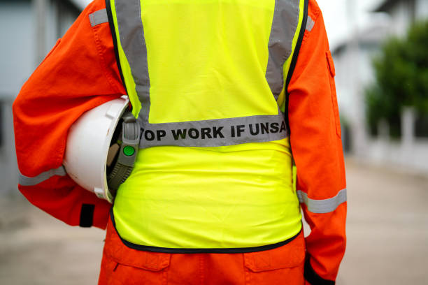 istock A crane signaler with fully safety PPE uniform. 2170987478