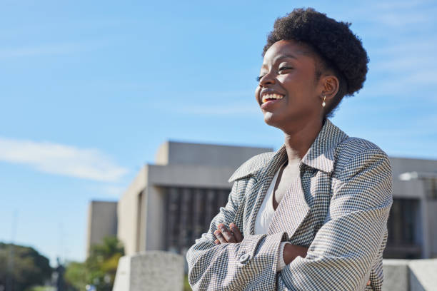 istock Confident Woman Smiling Outdoors in Urban Setting 2170993598