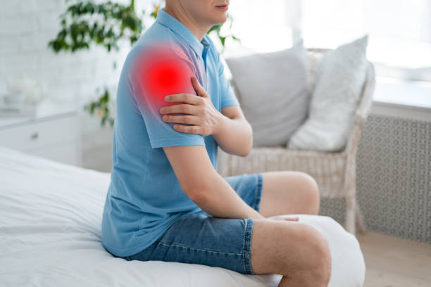 istock Dislocation of the shoulder, joint inflammation, arthritis and degenerative changes, man with pain in hand at home 2170997562