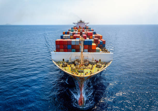 istock Aerial front view of a big cargo container carrier ship in motion 2170998289