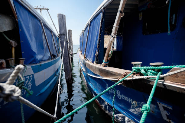 Zanzibar, Tanzania - February 18, 2008: African fishermen go fishing near the shore.