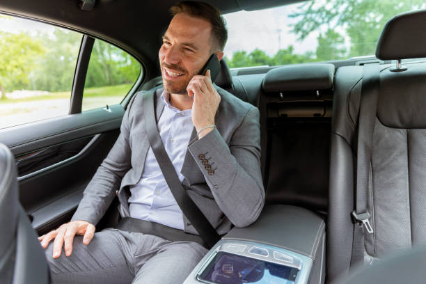 istock Professional businessman enjoying a conversation on his smartphone during a comfortable car ride 2171001609