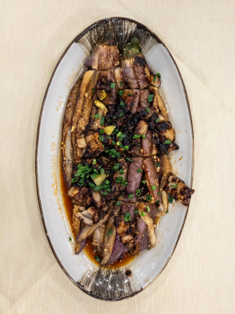 istock Douchi pork belly steamed eggplant on a dinner plate 2171001646