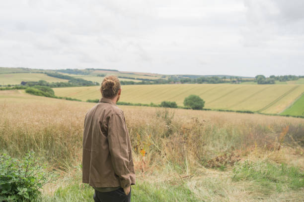 istock Young man explores rural landscape 2171003334