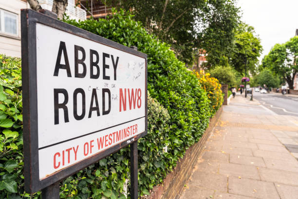 London, UK - A sign for Abbey Road in north London by the pavement.