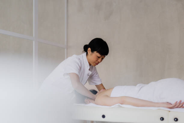 istock An Asian masseuse performing a massage 2171004393