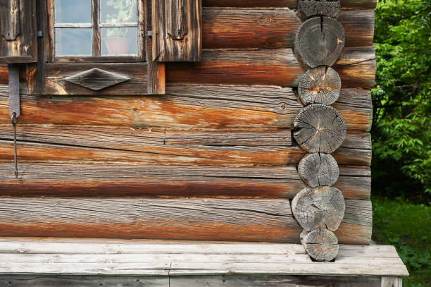 Close-up of a wooden rustic house exterior, showcasing traditional carpentry