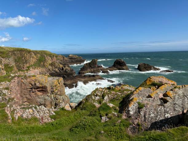istock Rugged Scottish Coastline with Waves and Rocks on a summer day 2171006104