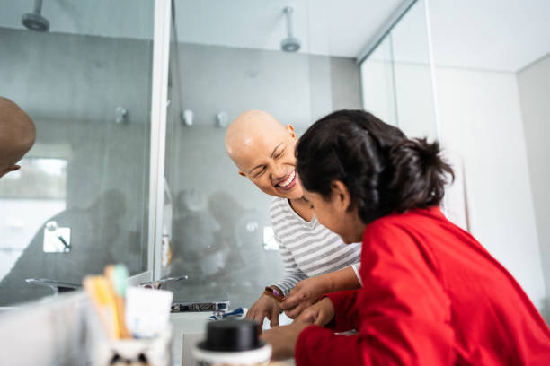 istock Mother and daughter brushing teeth at home 2171008781