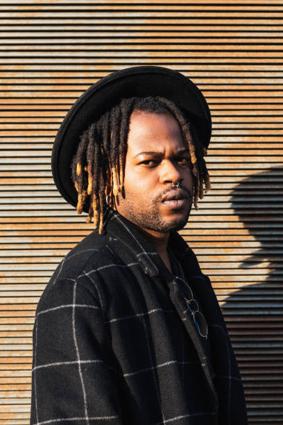 istock Stylish black man with dreadlocks on street 2171012142