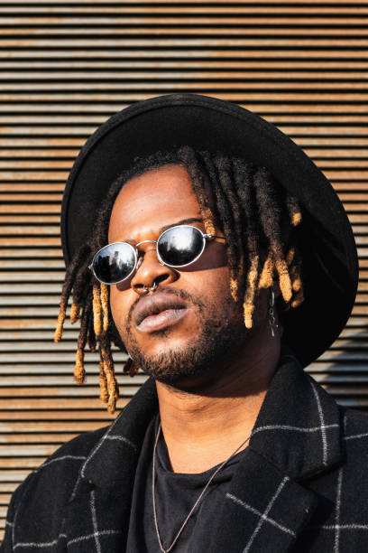 istock Stylish black man with dreadlocks on street 2171012255