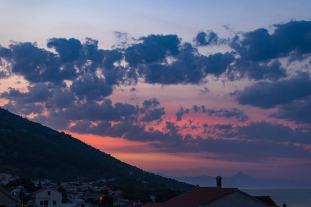Adriatic highway (E65) along Adriatic coastline by Velebit mountain range at sunset, Dalmatian coast, Croatia