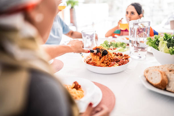 istock Family serving pasta during lunch at home 2171013691