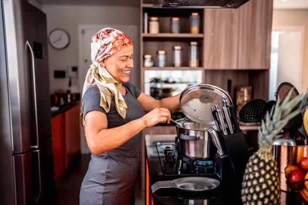 istock Mature woman cooking at home 2171014171