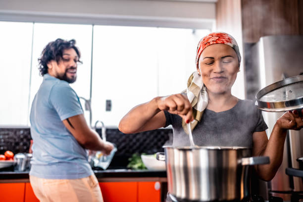 Mature woman cooking at home