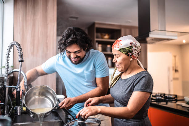 istock Couple preparing pasta together at home 2171014372