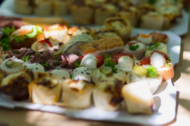 istock assorted appetizers featuring elegant bites with meats and vegetables arranged on a platter at a summer outdoor gathering 2171014433