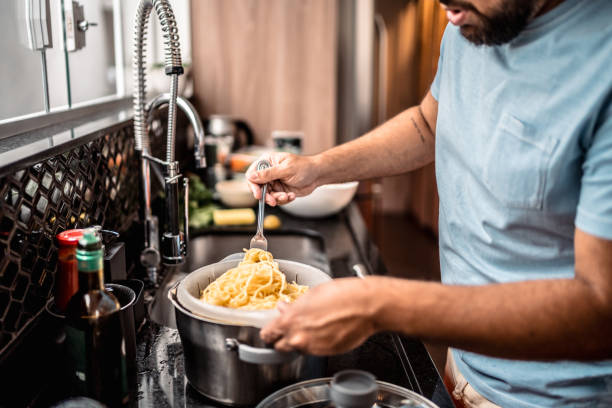istock Close-up of man preparing past at home 2171015634