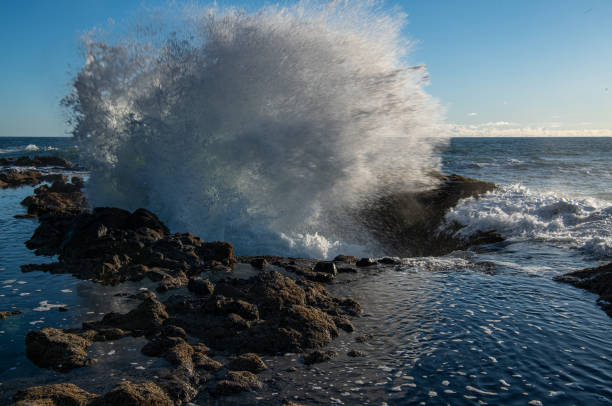 This famous landmark, Thor's Well, is a rocky whirlpool of sorts that sometimes has drainage into it, creating the effect of an infinity pool.  However, in this instance, I captured its explosive nature as waves crash against the rocks.