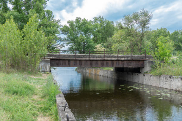 istock Iron concrete bridge over the river canal. 2171016941