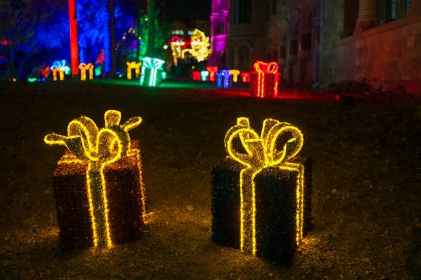 istock Colorful illuminated gift-shaped Christmas decorations in an out 2171017341
