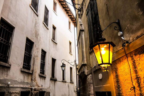 istock A narrow alleyway with a lamp hanging from the wall 2171019207