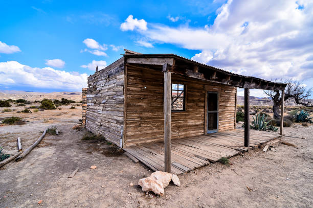 istock A small, old house with a porch sits in a desert 2171019690