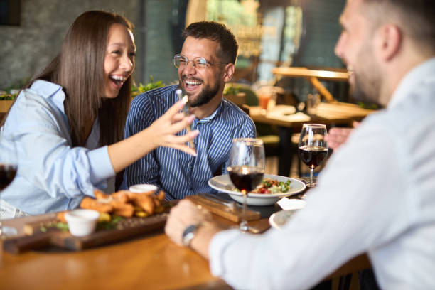 istock Group of happy entrepreneurs having fun during lunch in a restaurant 2171020599