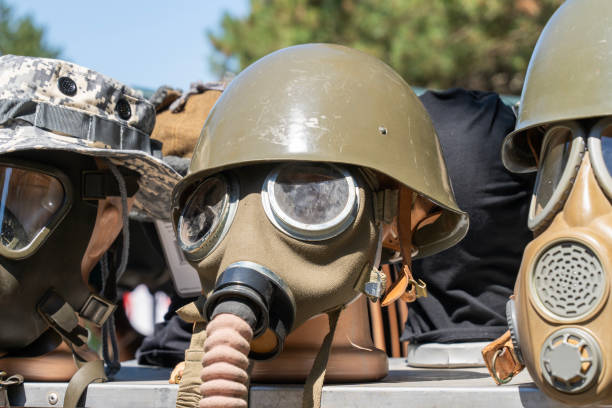 A plumed helmet of the Italian Bersaglieri military corps used in the African campaigns during the Second World War, next to a 1938 Moto Guzzi assigned to the Bersaglieri during the war. The feathers used in the hats and helmets of the Italian Bersaglieri are strictly of animal origin, in particular from capercaillie farms. Characterized by the famous plumed helmet and always marching at a fast pace or by bicycle, the Bersaglieri are one of the oldest military corps of the Italian army, founded in 1836 by General Alessandro La Marmora. Image in high quality format.