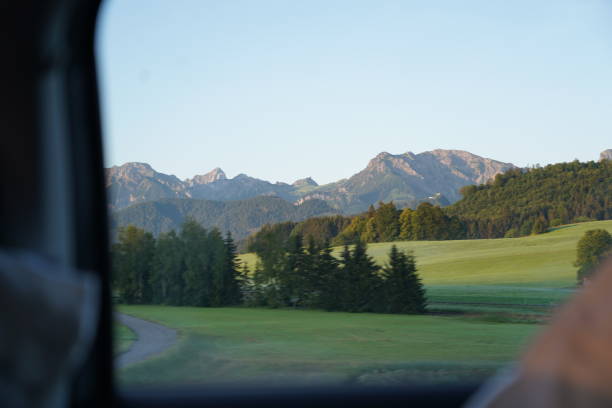 Early morning with alpine mountain inside a car