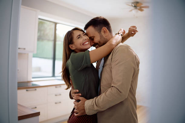 istock Embraced couple feeling excited after buying their first home. 2171027396
