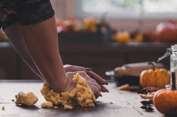 istock Woman preparing pumpkin pie at home 2171035311
