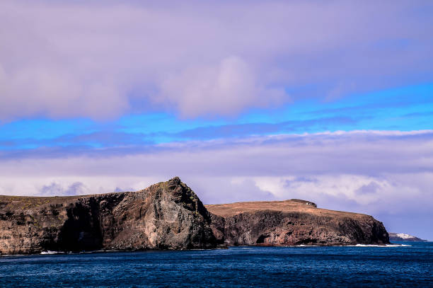 istock A rocky shoreline with a cloudy sky in the background 2171041152