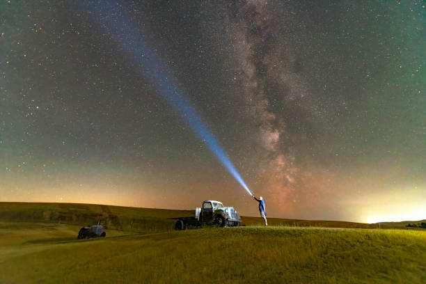 A photo of the Milky Way with an antique farm implement in the foreground.  Taken in the Palouse region of Washington State.