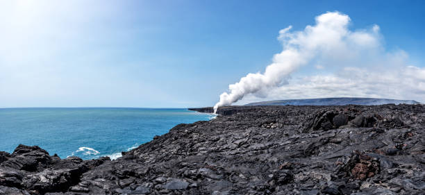 Kamokuna ocean entry on the south-east side of the Big Island. The lava is gushing into the ocean from a tube that was exposed when a 26-acre lava delta collapsed into the ocean at the site.