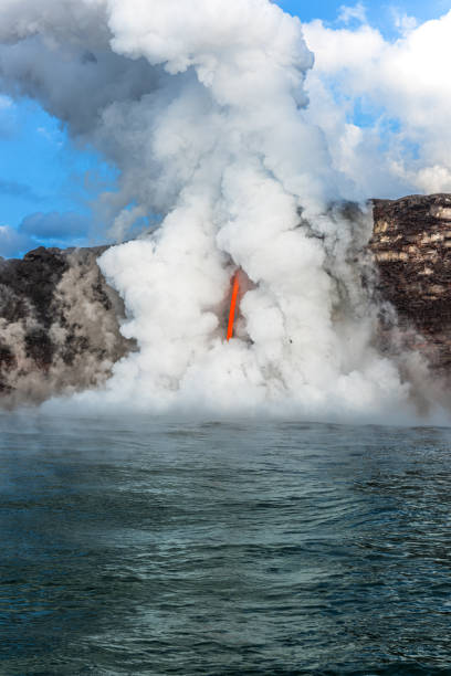 Hawaii's Kilauea volcano eruption formed a lava tube coming out the side of a cliff and emptying into the ocean, causing explosions, steam, chemical reactions, and tremendous amounts of heat.