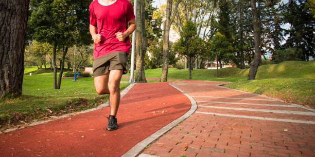istock Unrecognizable man running in natural park 2171046457