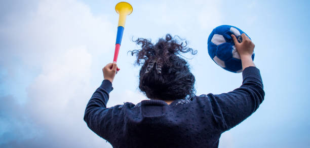 istock Girl soccer fan 2171046500