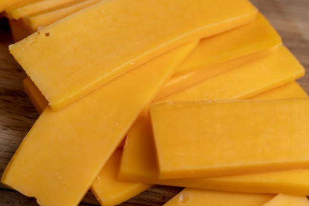 istock slicing yellow cheese close-up 2171048287