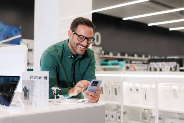 istock A customer browsing the latest smart phone models in a store 2171051946