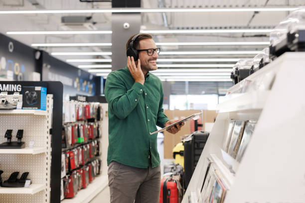 istock A handsome man shopping for records in a music store 2171052018