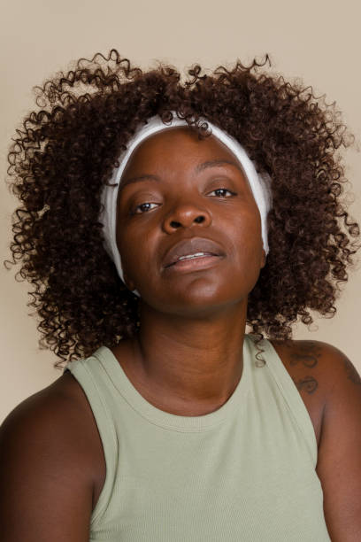 istock woman with afro hair posing in studio 2171054355