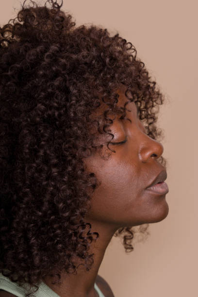 istock woman closing her eyes and relaxing 2171054652
