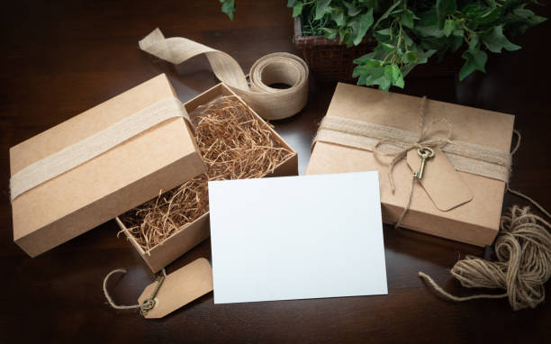 istock Gift Packaging Boxes Mock Up with Jute String, Blank Card and Tags with Small Key on Wood Surface Ready For Your Branding. 2171054991