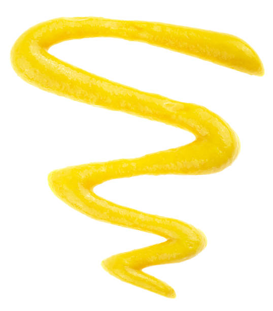Mustard sauce isolated on a white background, view from above. Mustard salad dressing splash.