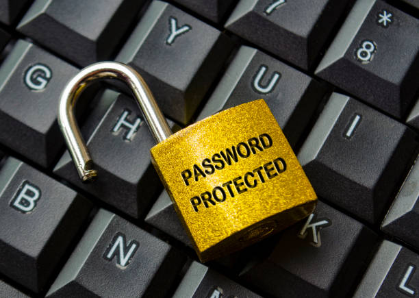 istock Top view of password protected text engraved on padlock with keyboard background. Password security concept 2171055195