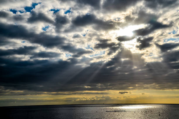 istock The sky is cloudy and the sun is shining through the clouds 2171055902